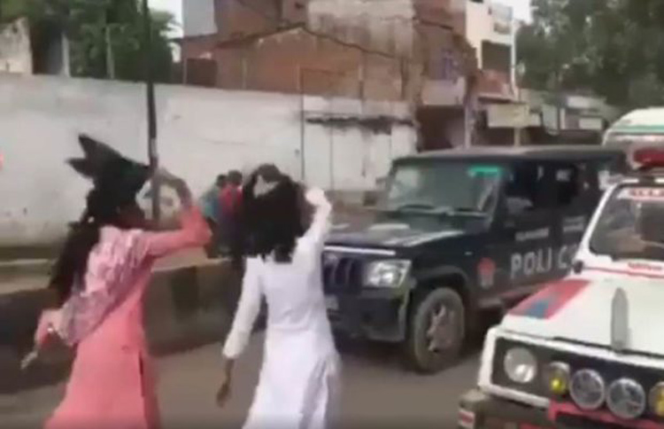 इलाहाबाद में अमित शाह को दिखाए गए काले झंडे, दो युवतियां गिरफ्तार