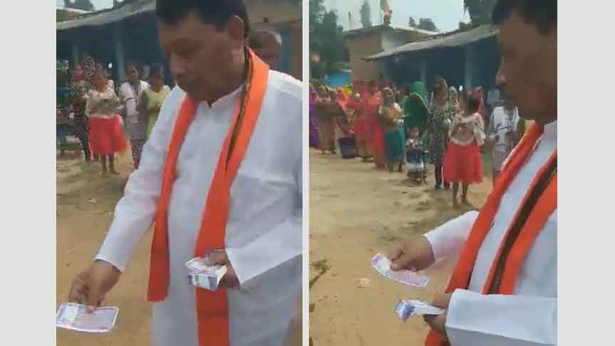 वोट के लिए नोट बांट रहे बीजेपी के मंत्री कैमरे में कैद, कांग्रेस ने की कार्रवाही की मांग